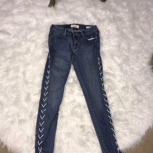 Pacsun skinny jeans tied up on the sides